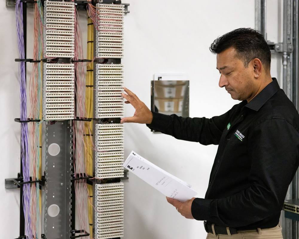 Foster’s technician checking a cabling distribution frame